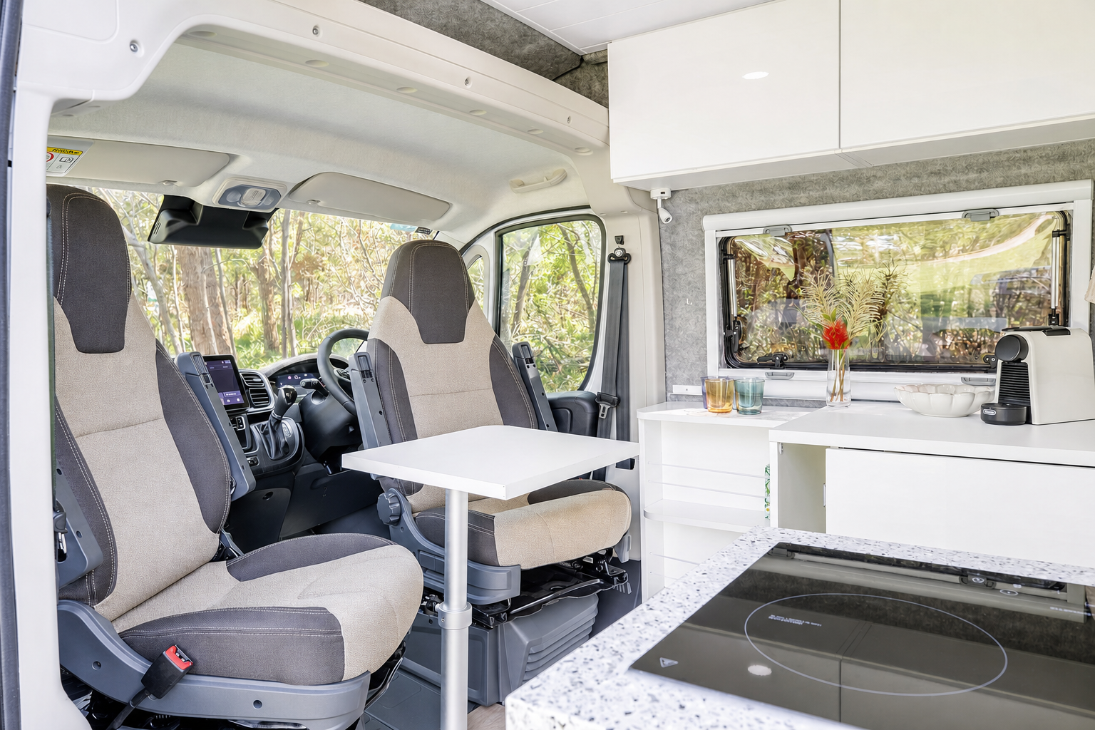 Swivel cab seats and pedestal dining table inside Avalon